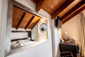 Postel nebo postele na pokoji v ubytování Antico Borgo Chieti