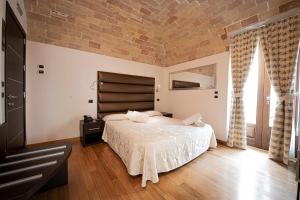 Postel nebo postele na pokoji v ubytování Antico Borgo Chieti