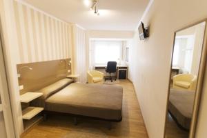 Posteľ alebo postele v izbe v ubytovaní Residencia Compostela