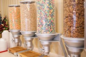 a group of glass vases filled with cereal at Blue Gate Garden Inn in Shipshewana