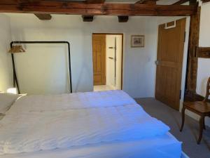 Voodi või voodid majutusasutuse Guesthouse Les Mignardises toas