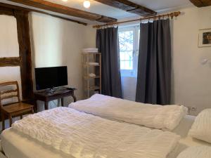 
Ein Bett oder Betten in einem Zimmer der Unterkunft Guesthouse Les Mignardises
