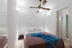 Arco Naxos Luxury Apartments 객실 침대