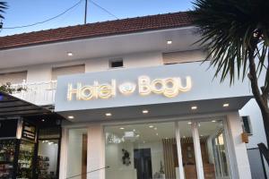a hotel bag sign on the front of a store at Bagu Playa Grande Hotel in Mar del Plata