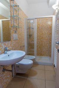 a bathroom with a toilet and a sink and a shower at le terrazze sul mare gallipoli in Gallipoli
