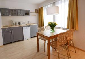 Kuchyň nebo kuchyňský kout v ubytování Hotel Villa Granitz