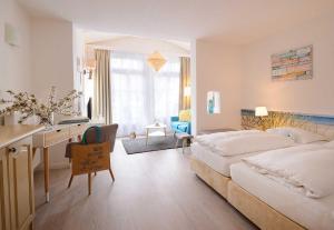 Postel nebo postele na pokoji v ubytování Hotel Villa Granitz