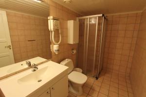 Koupelna v ubytování Fanitullen Apartments + 29 fotografií