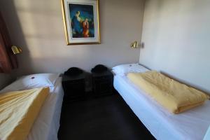 Postel nebo postele na pokoji v ubytování Fanitullen Apartments