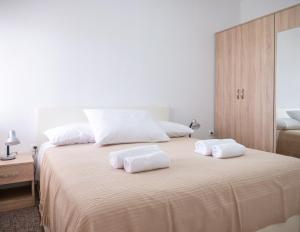 Posteľ alebo postele v izbe v ubytovaní Apartments Tri Mora