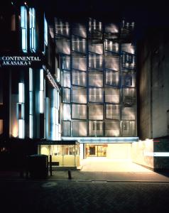 a building that is lit up at night at Centurion Hotel Residential Akasaka Station in Tokyo