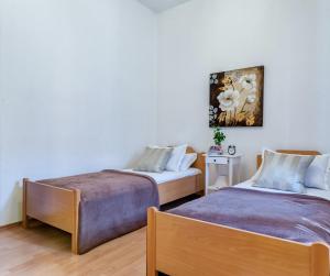 Postel nebo postele na pokoji v ubytování Apartments Bralić