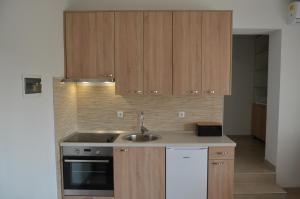 Kuchyňa alebo kuchynka v ubytovaní Apartments Tri Mora