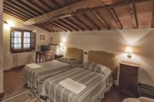 Posteľ alebo postele v izbe v ubytovaní Relais Santa Cristina