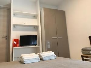 Łóżko lub łóżka w pokoju w obiekcie La Maggiolina camere La Spezia