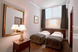 Letto o letti in una camera di Tea for Two Hotel