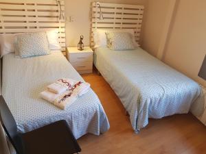 Posteľ alebo postele v izbe v ubytovaní Apartamentos Albero