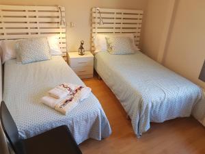 Posteľ alebo postele v izbe v ubytovaní Apartamentos Albero