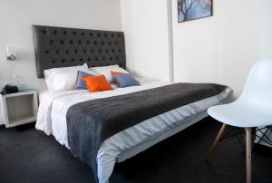 Postel nebo postele na pokoji v ubytování Hotel Grand H&R