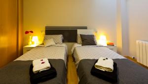 Posteľ alebo postele v izbe v ubytovaní Apartamentos Albero