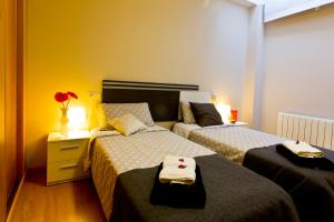 Posteľ alebo postele v izbe v ubytovaní Apartamentos Albero
