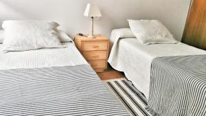 Postel nebo postele na pokoji v ubytování Apartamento Rías Baixas - 1a Línea Playa Raxó