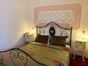 a bedroom with a bed and two night stands at Hotel Mirto in Litochoro