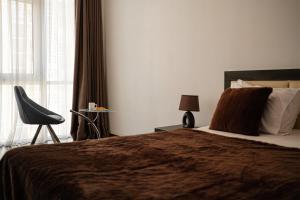 Posteľ alebo postele v izbe v ubytovaní Barkar ArCadia Apartments