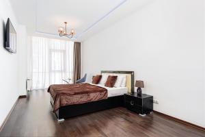 Posteľ alebo postele v izbe v ubytovaní Barkar ArCadia Apartments
