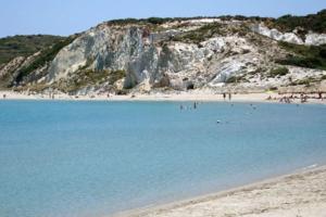 a beach with a bunch of people in the water at XALAKAS SUMMER HOUSE in Empourios