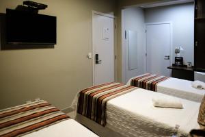 Postel nebo postele na pokoji v ubytování Ideali Hotel