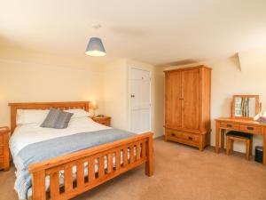 Posteľ alebo postele v izbe v ubytovaní Upper Barn Cottage