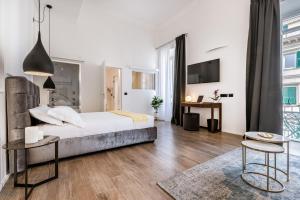 Postel nebo postele na pokoji v ubytování La Spezia by The First - Luxury Rooms & Suites