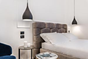 Postel nebo postele na pokoji v ubytování La Spezia by The First - Luxury Rooms & Suites