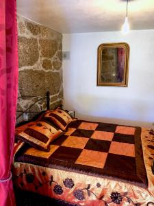 A bed or beds in a room at Casa da Quinta da Prelada Simão partie basse