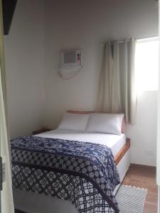 Postel nebo postele na pokoji v ubytování som das aguas paraty