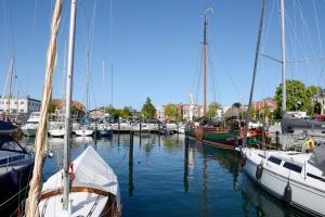 a group of boats docked in a harbor at Deck 2 Laboe Ostsee in Laboe