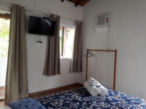 Postel nebo postele na pokoji v ubytování som das aguas paraty