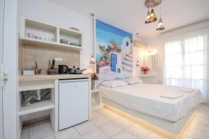 Ένα ή περισσότερα κρεβάτια σε δωμάτιο στο simos luxury apartments