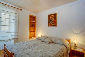 Postel nebo postele na pokoji v ubytování House Mihaela