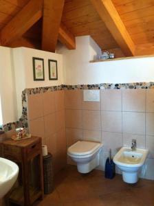 a bathroom with a toilet and a sink at B&B Alba Sul Lago in Pergine Valsugana +64 photos