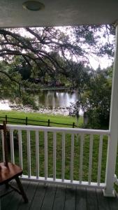 a view of a lake from the porch of a house at Tampa Lakehouse in Tampa