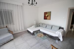 A bed or beds in a room at Luca Apartments