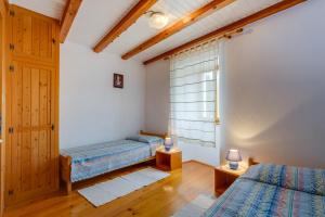Postel nebo postele na pokoji v ubytování House Mihaela