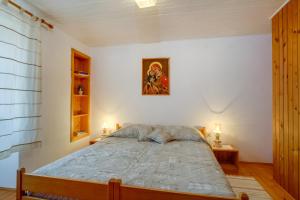 Postel nebo postele na pokoji v ubytování House Mihaela