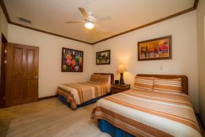 Cama o camas de una habitación en Los Suenos Resort Veranda 6D