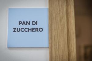 a sign that says pan dr zucchini on a wall at Bed and Breakfast Porto Flavia in Iglesias
