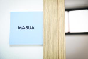 a sign with the word masaya on it next to a window at Bed and Breakfast Porto Flavia in Iglesias