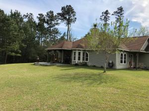 a house with a large yard in front of it at Little House on the Corner in Livingston
