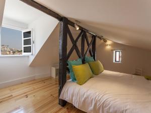 
A bed or beds in a room at Apartamento da Condessa
